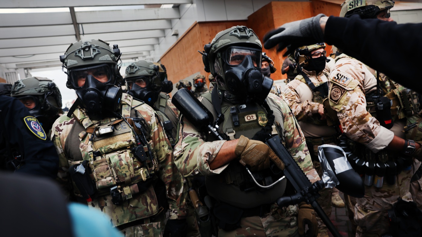 Trump federalizes the National Guard in Chicago, while troops arrive in Oregon : NPR