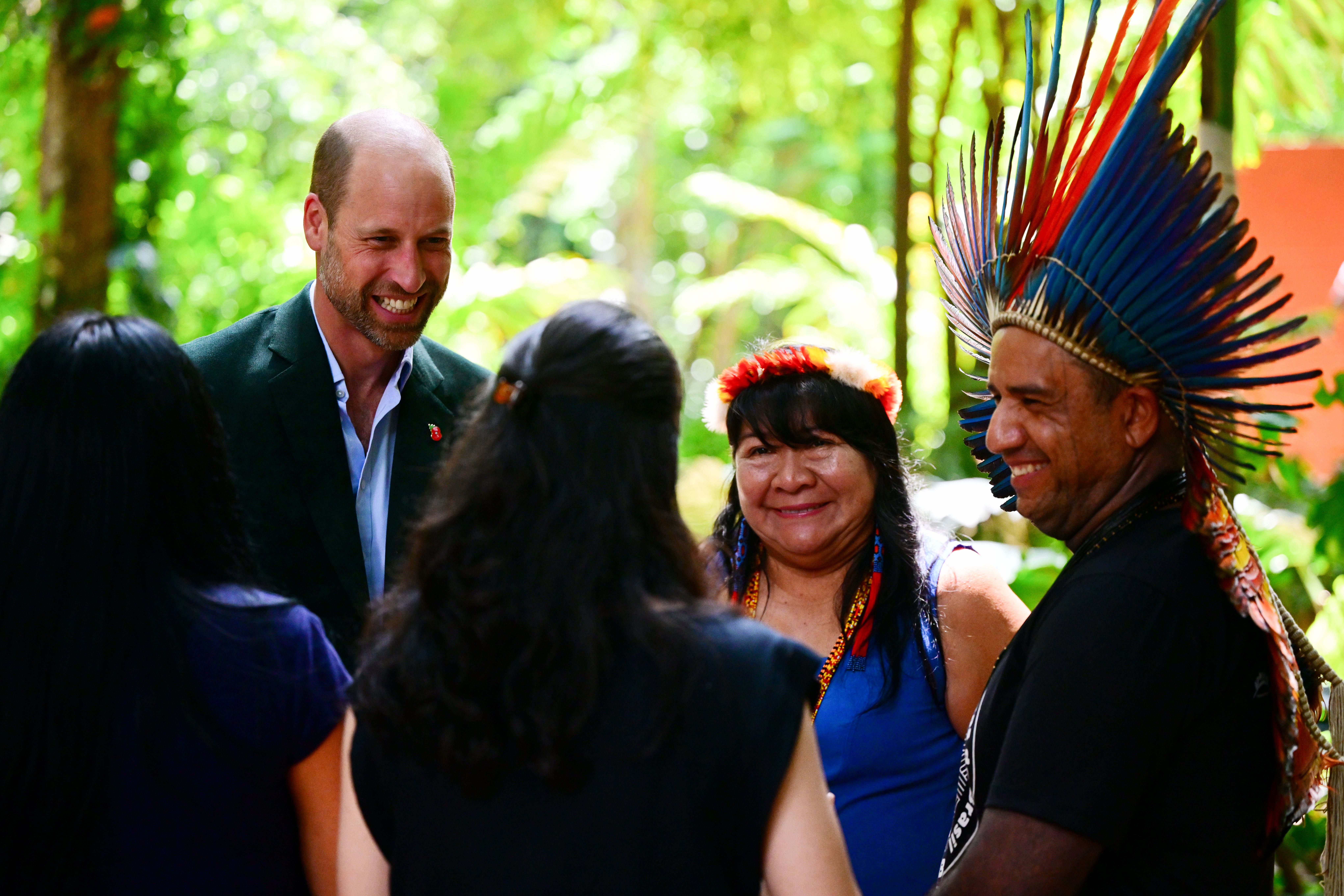 Prince William smiling while meeting with Indigenous Peoples, including Joenia Wapichana, at Museu Emilio Goeldi in Brazil.