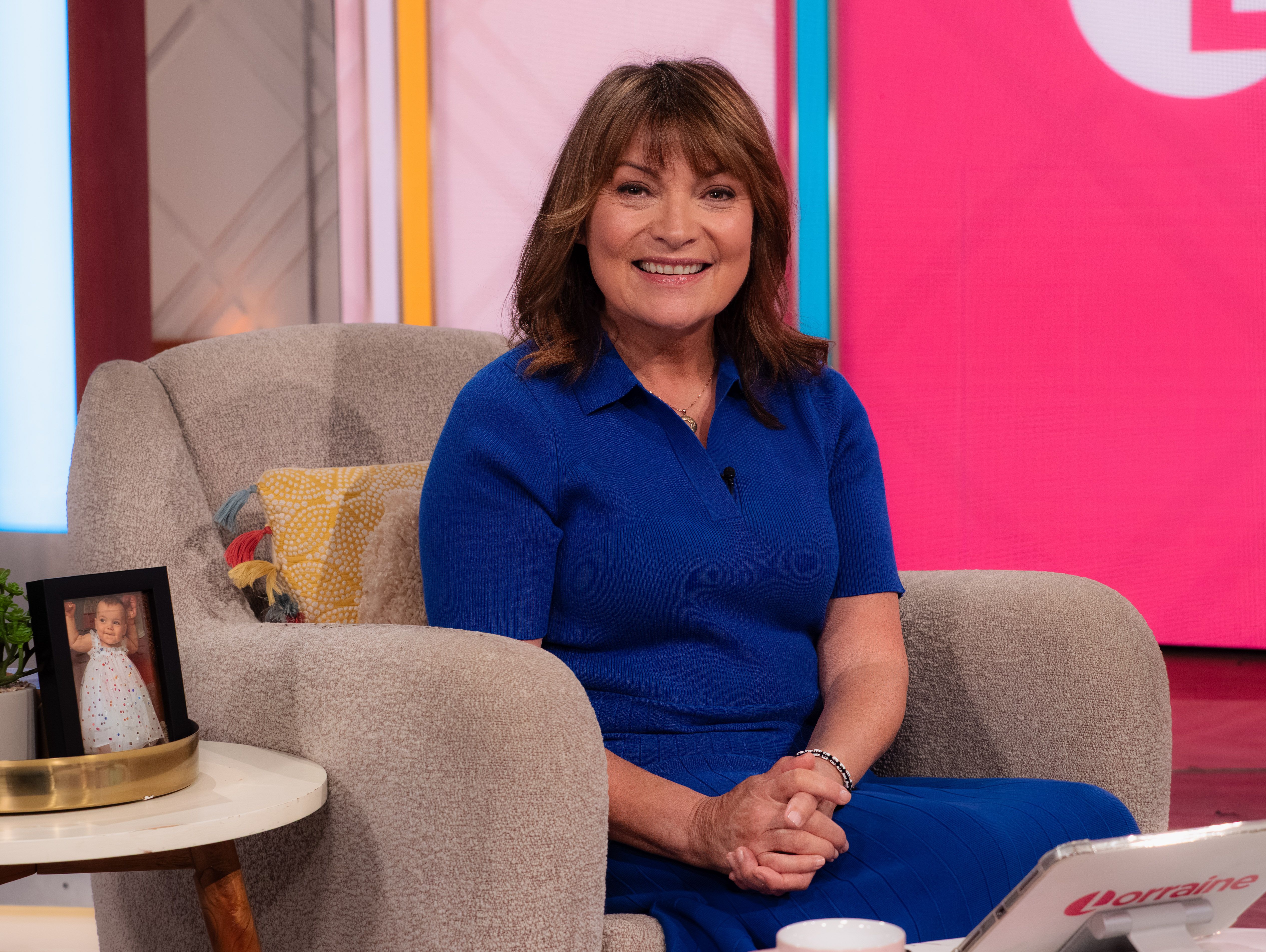 Lorraine Kelly sitting in a chair on the set of the 'Lorraine' TV show.