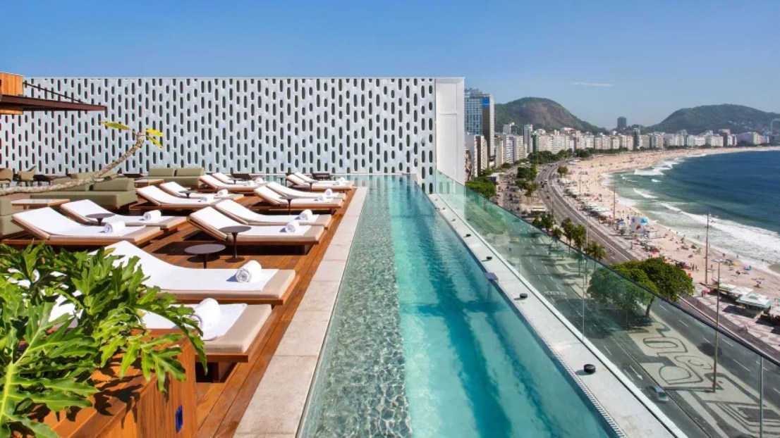 Rooftop pool deck of the Emiliano Rio Hotel overlooking Copacabana Beach in Rio de Janeiro.
