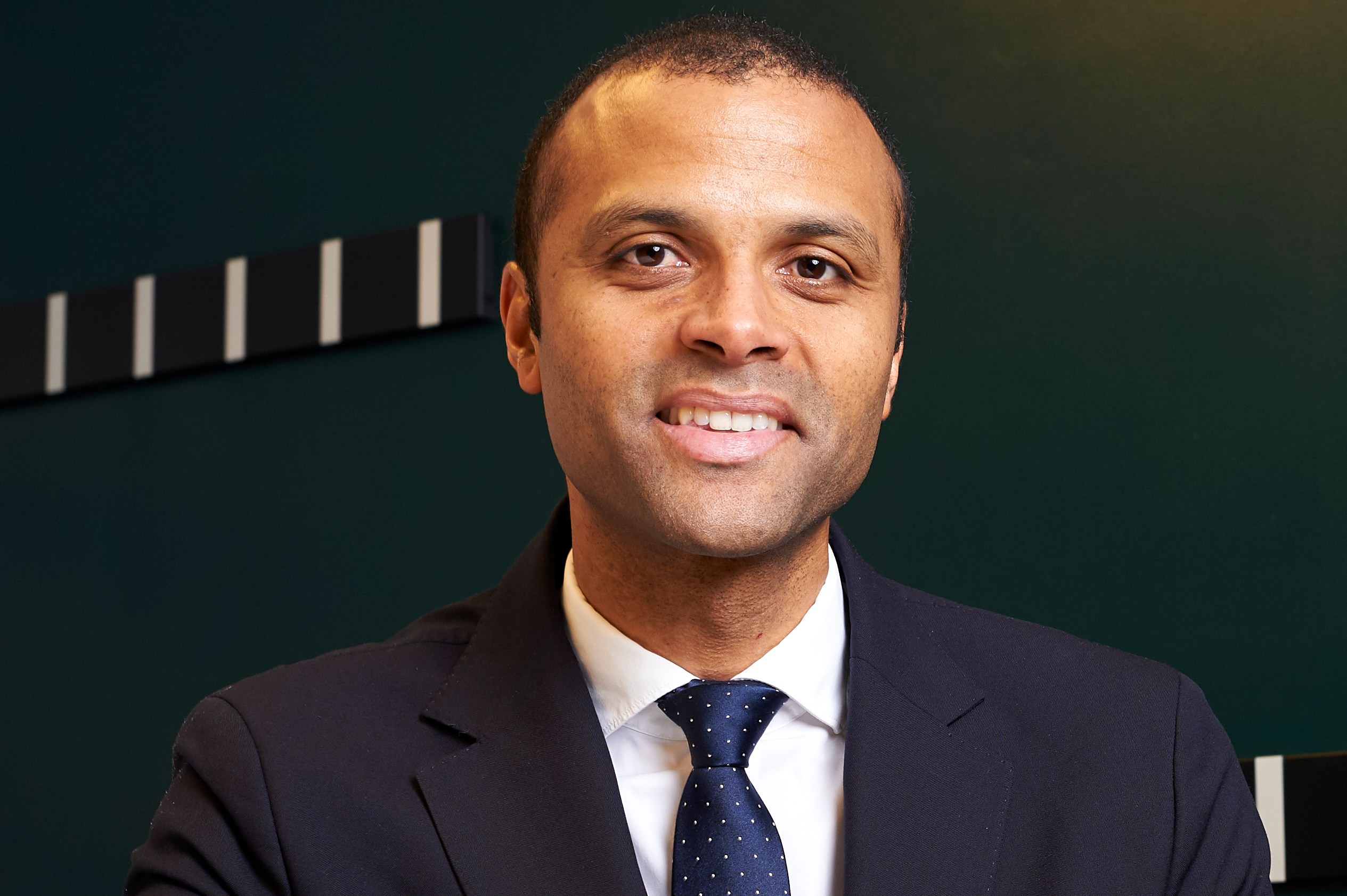 Maheta Molango, PFA CEO, smiling in an office setting.