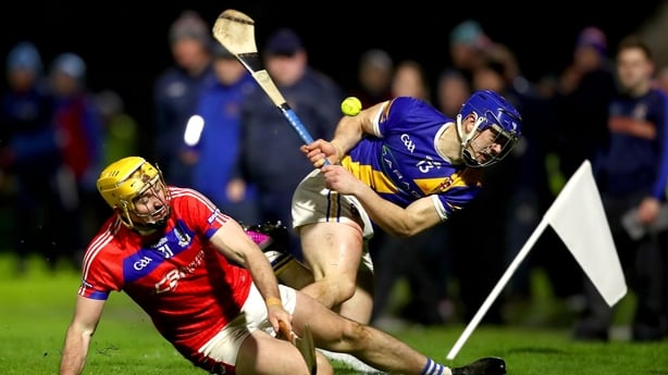 Anthony Burns of Loughrea (r) in action against Cian Mahony of St Thomas's - 2025 Galway hurling final