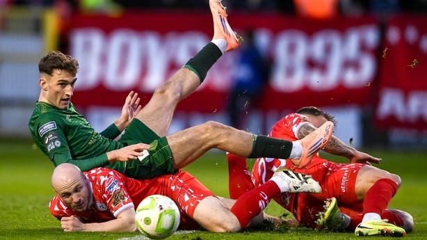 Mason Melia of St Patrick's Athletic is tackled by Paddy Barrett, right, and Kerr McInroy of Shelbourne during the SSE Airtricity Men's Premier Division match between Shelbourne and St Patrick's Athletic at Tolka Park in Dublin.