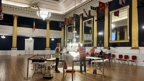 A chandelier is cleaned at Dublin Castle ahead of the inauguration