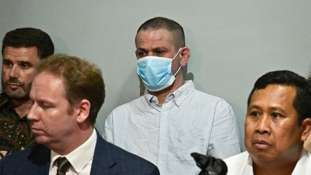 Shahab Shahabadi wears a face mask at a press conference 