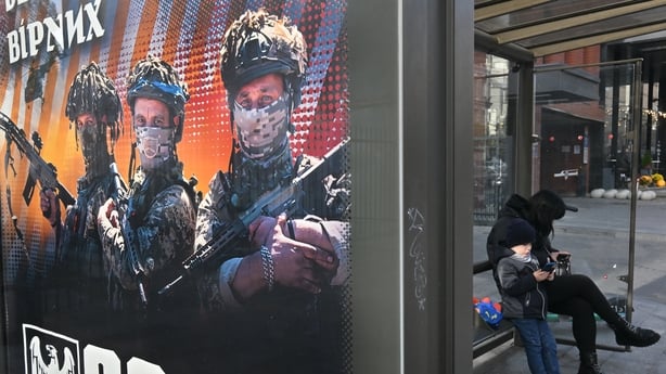  photograph shows a recruiting placard for the ukrainian army