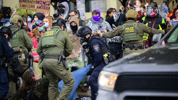 Federal agents detain an anti-I.C.E. protester at the US Immigration and Customs Enforcement building in Portland.