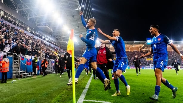 Slovakia's forward #08 Tomas Bobcek (C) celebrates scoring his team's first goal with fans and team mates just before the end of the World Cup 2026 European Qualifiers football match between Slovakia and Northern Ireland on November 14, 2025 in Kosice, Slovakia. Slovakia won the match 1-0. (Photo by