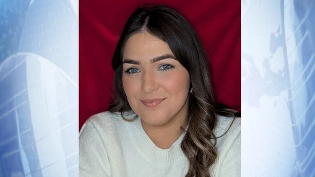 a photograph on a blue background of chloe mcgee