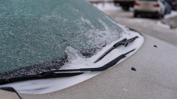the windscreen of a car is frosted over