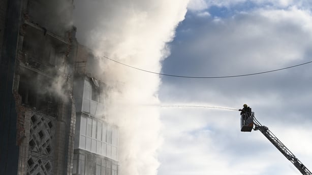 A Ukrainian rescue personnel battles a blaze at a heavily damaged residential building following Russian air strike in the city of Ternopil, on November 19, 2025, amid the Russian invasion of Ukraine. The number of people killed in a Russian missile and drone strike on the western Ukrainian city of 