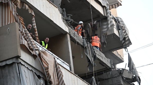 Security forces, civil defenCe, and firefighting teams arrive at the scene following an Israeli attack on the Dahieh region of Beirut, Lebanon 