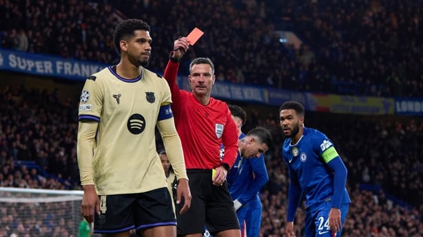 Ronald Araujo of FC Barcelona is shown a red card and sent off for a tackle on Marc Cucurella of Chelsea FC during the UEFA Champions League 2025/26 League Phase MD5 match between Chelsea FC and FC Barcelona at Stamford Bridge on November 25, 2025 in London, England. 