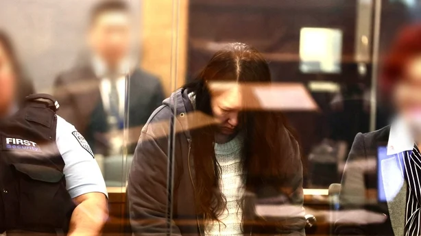 Hakyung Lee looks down during her sentencing to life imprisonment in a New Zealand court