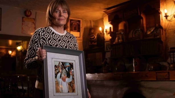 Mary Meany holds an image of her father