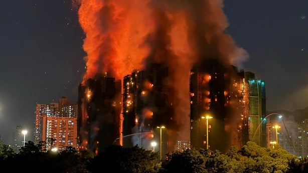 Thick smoke and flames rise as a major fire engulfs several apartment blocks in Hong Kong