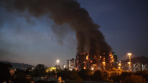 Thick smoke and flames rise as a major fire engulfs several apartment blocks in Hong Kong