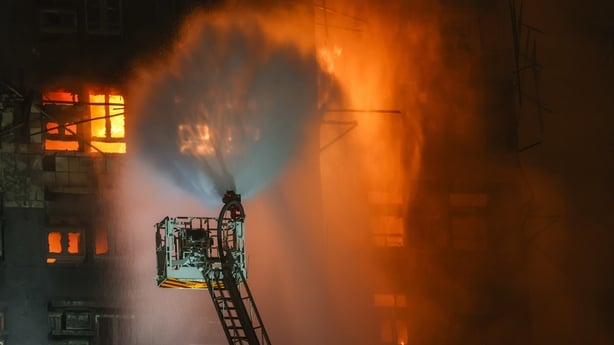 Firefighters tackle a fire engulfing residential buildings at Wang Fuk Court in the Tai Po district of Hong Kong, China