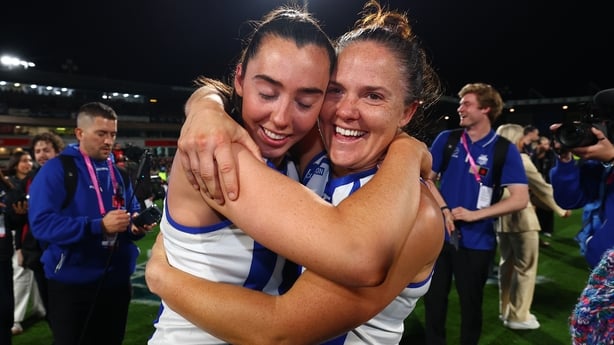 MELBOURNE, AUSTRALIA - NOVEMBER 29: Blaithin Bogue and Emma Kearney of the Kangaroos celebrate after the AFLW Grand Final match between North Melbourne Kangaroos and Brisbane Lions at Ikon Park on November 29, 2025 in Melbourne, Australia. (Photo by Daniel Pockett/Getty Images)