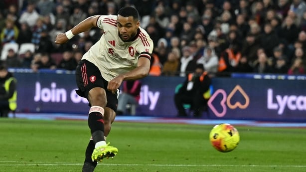 Liverpool's Dutch striker #18 Cody Gakpo shoots to score their second goal during the English Premier League football match between West Ham United and Liverpool 