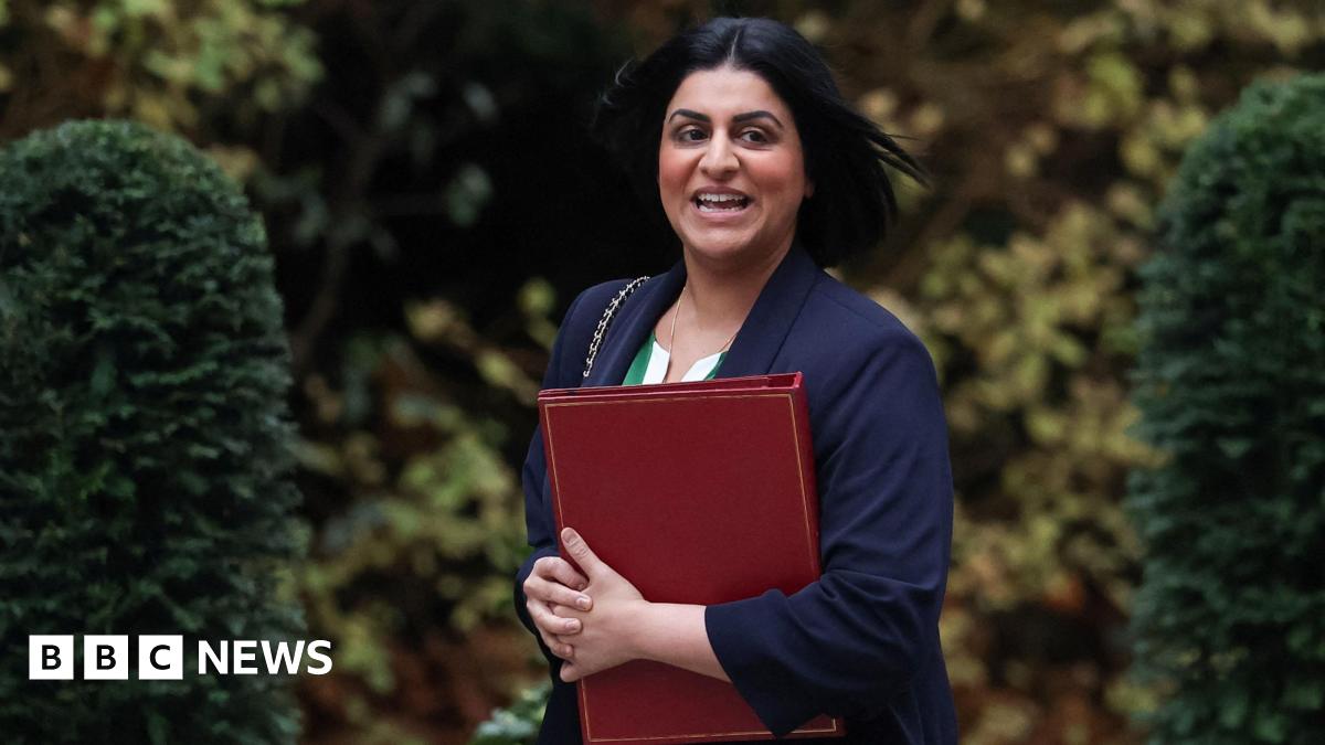 Home Secretary Shabana Mahmood walks outside Downing Street with a red binder