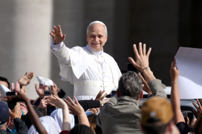 Pope Leo waves as he arrives ahead of his Inauguration Mass in May in Vatican City.