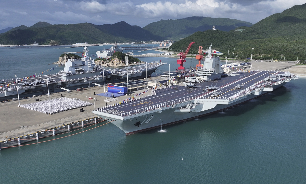 The commissioning and flag-presenting ceremony of the <em>Fujian</em>, China's first aircraft carrier equipped with electromagnetic catapults, is held at a naval port in Sanya City, South China's Hainan Province, on November 5, 2025. Photo: Xinhua