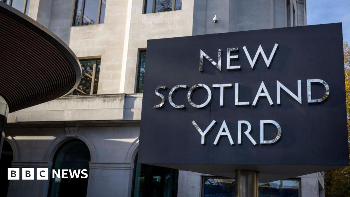 A photo of the sign outside the Met headquarters that reads: "New Scotland Yard".