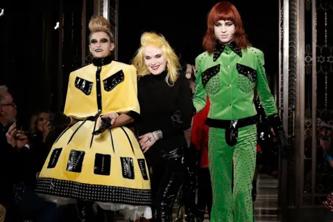 Getty Images Designer Pam Hogg (C) and model Alice Dellal (L) walk the runway at the Pam Hogg show at Fashion Scout during London Fashion Week Autumn/Winter 2016/17 at Freemasons' Hall on February 19, 2016 in London, England