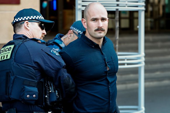 Thomas Sewell being arrested outside court in September.