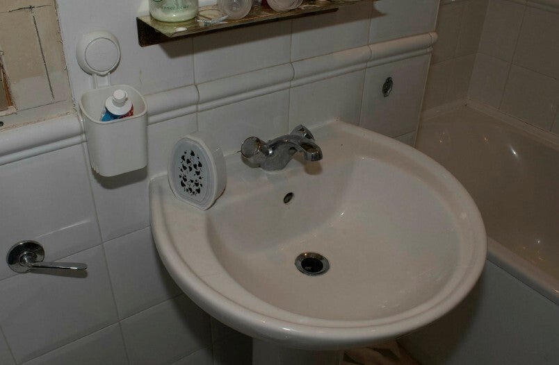 A camera was found hidden inside an air freshener at his flat in Greenwich
