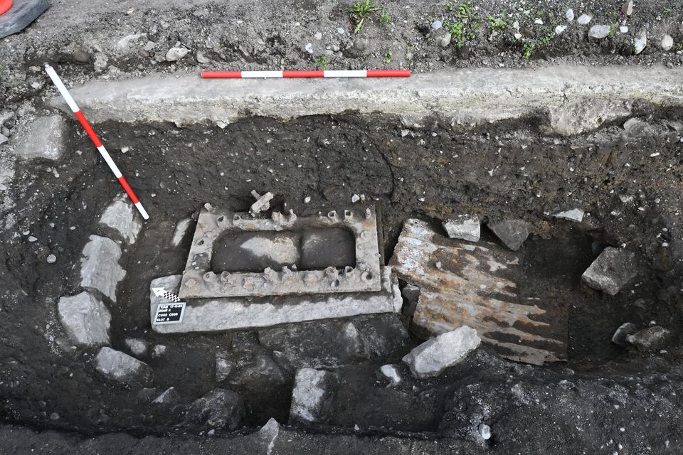 The base of a pump structure uncovered in the former workhouse yard area, with corrugated iron covering a historic drain repair. Credit: ODAIT