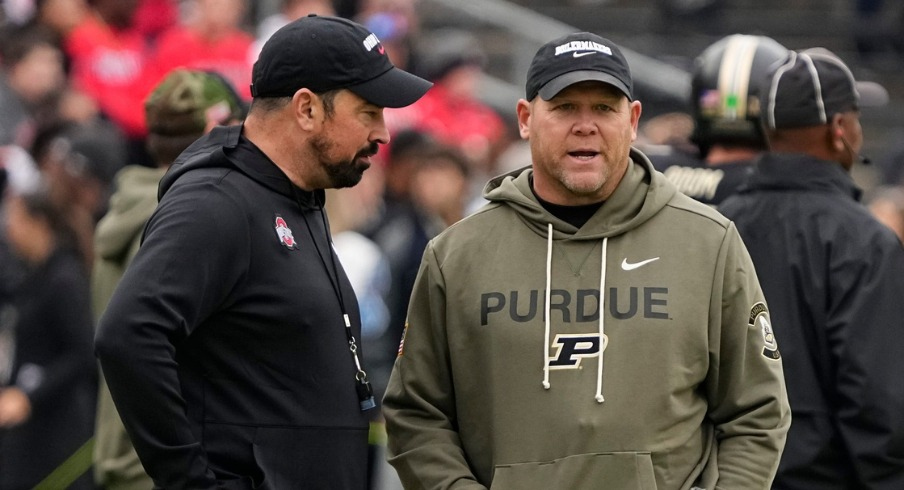 Ohio State head coach Ryan Day (left) with Purdue head coach Barry Odom (right)