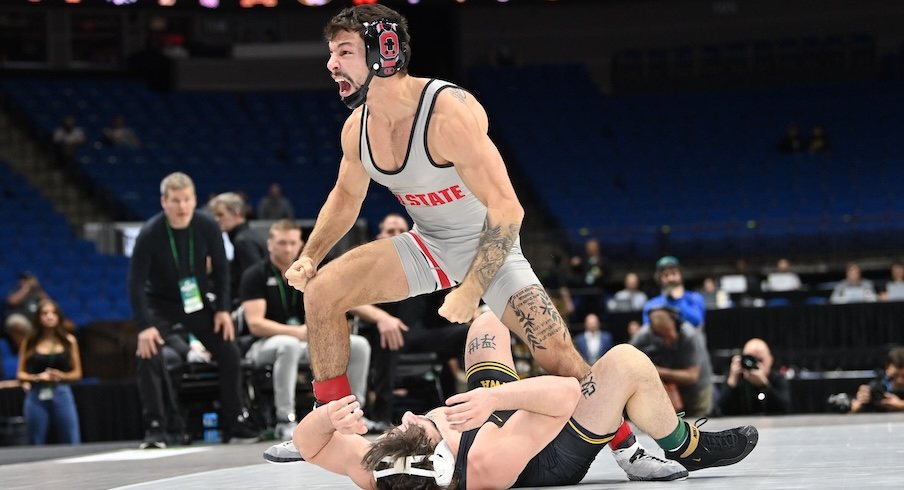 Nic Bouzakis celebrating his pin of Iowa’s Dean Peterson