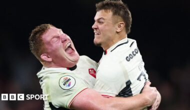 Wales fly-half Jarrod Evans is congratulated by prop Rhys Carre with both players having previously played for Cardiff
