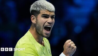 Carlos Alcaraz clenches his fist in celebration after beating Lorenzo Musetti