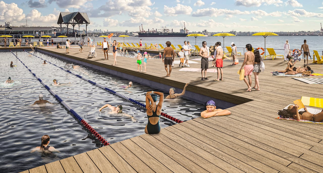 A wooden structure with swimming lanes in it on the ocean.