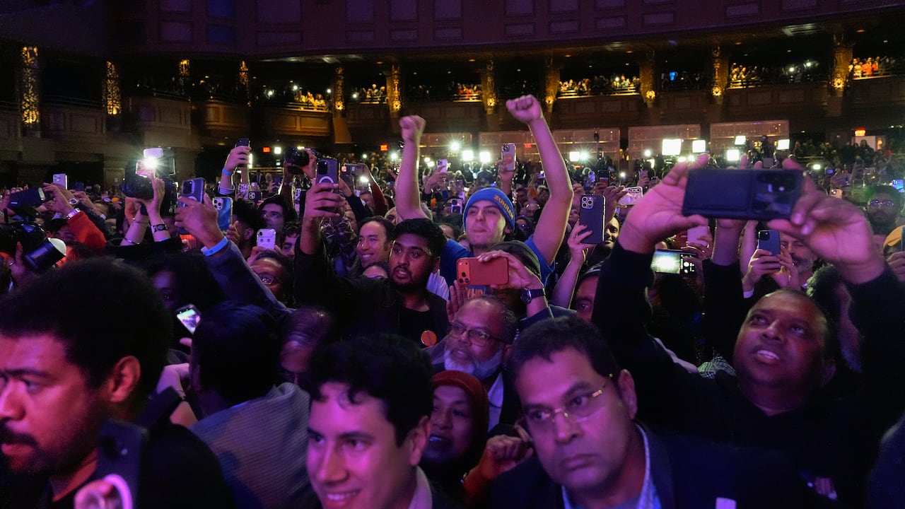 A crowd of cheering people