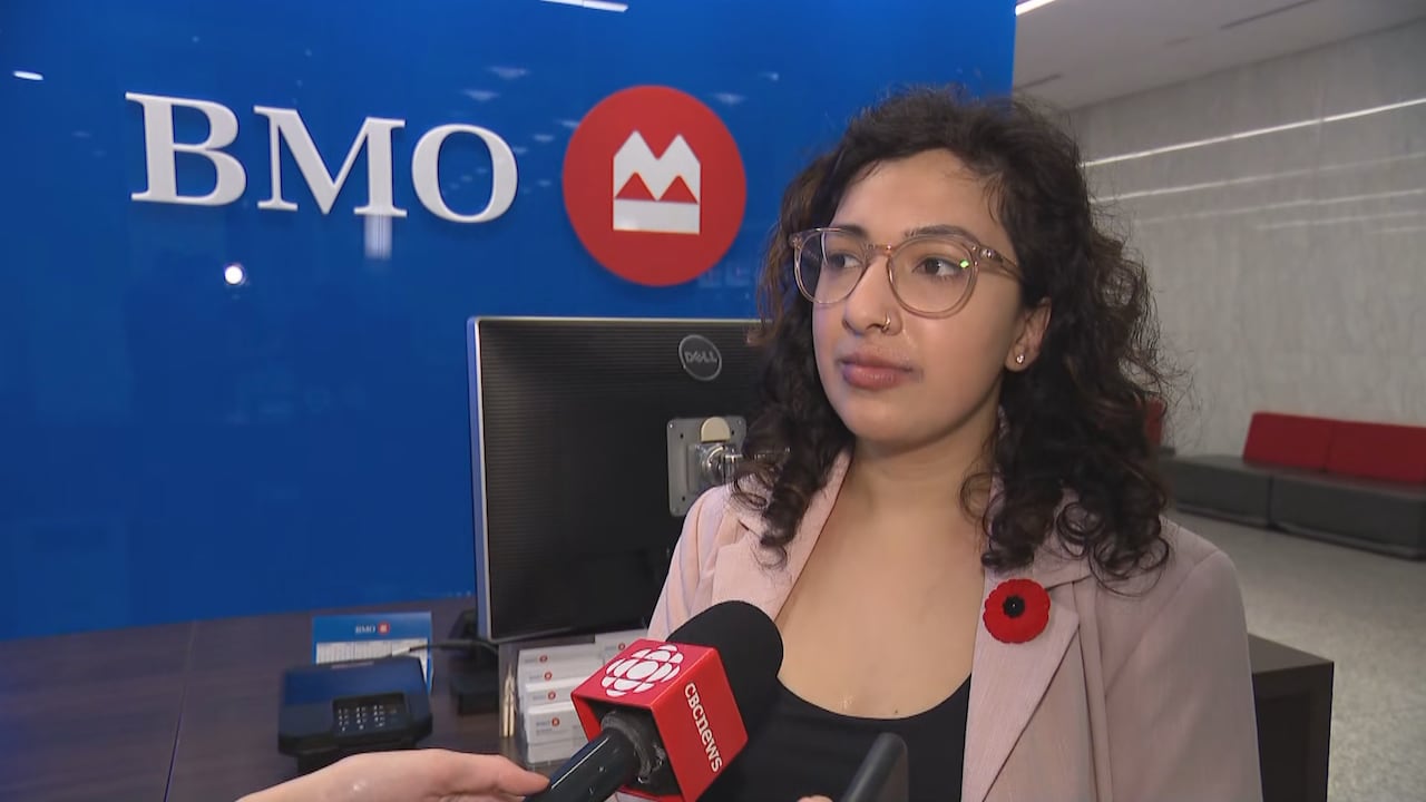 Woman interviewed in front of BMO logo. 
