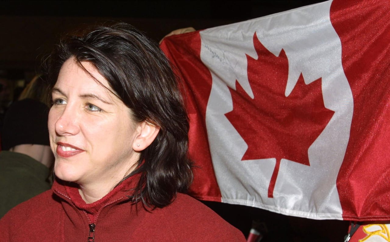 Danièle Sauvageau in 2002 returning home to Canada after her team won gold at the Salt Lake City Olympics.