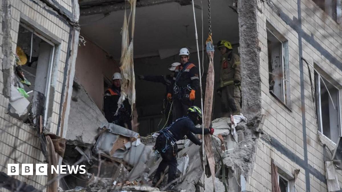 Rescuers work at the site of the apartment buildings hit during the Russian drone strike, amid Russia's attack on Ukraine, in Dnipro, Ukraine November 8, 2025.