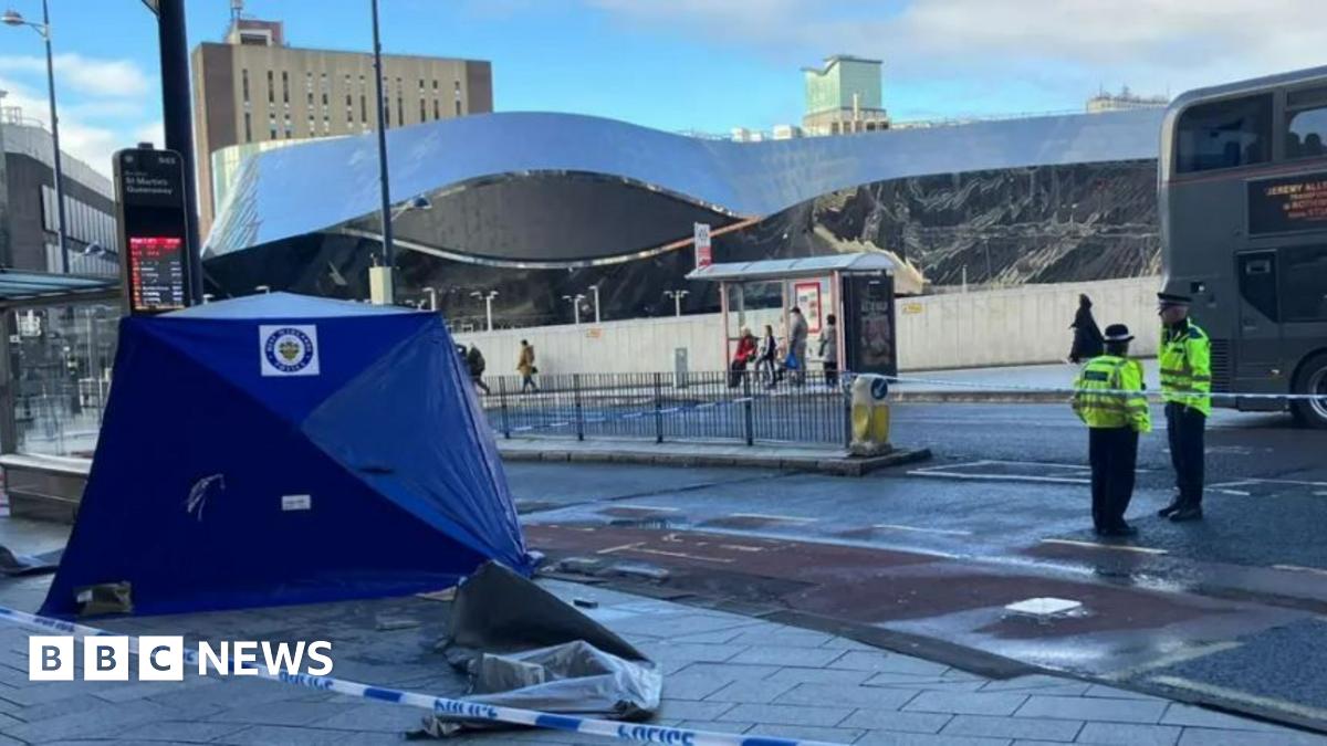 A blue police tent at the spot of a stabbing in Birmingham city centre. Grand Central can be seen in the background.