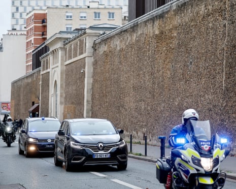 Vehicles believed to be carrying former French President Nicolas Sarkozy leave the Sante prison in Paris, France.