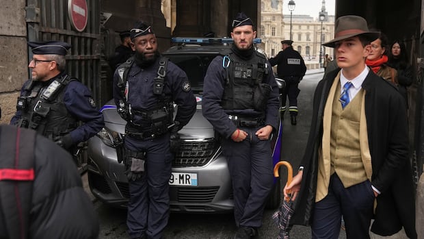 Turns out 'Fedora Man' in viral Louvre heist photo isn't AI — just a French teen with style