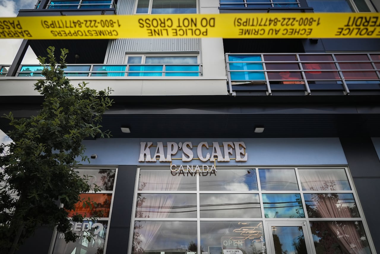 Police tape surrounds Kap's Cafe in Surrey, B.C., after it was targeted by gunfire for the second time in less than a month.