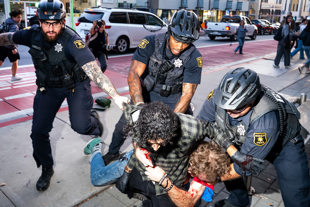 Anti-fascist protesters clash with attendees outside Turning Point event at UC Berkeley