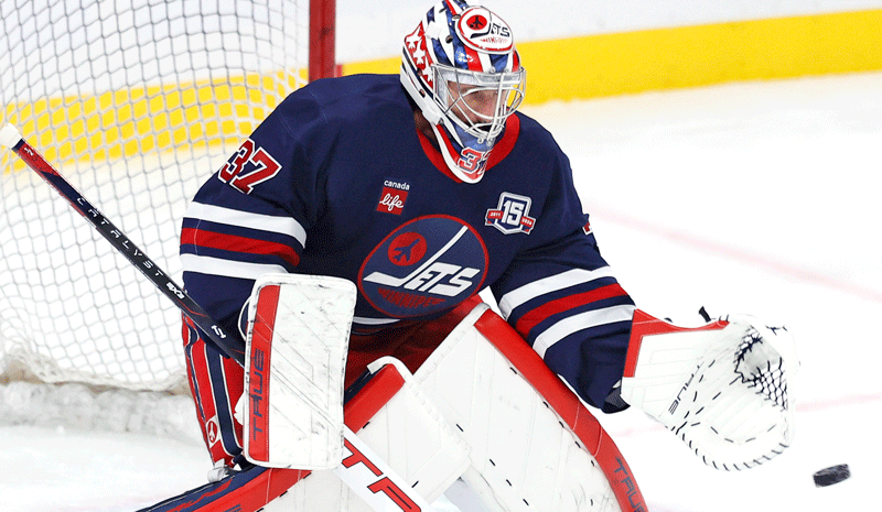Winnipeg Jets goaltender Connor Hellebuyck (37) warms up before a game against the Seattle Kraken at Canada Life Centre.