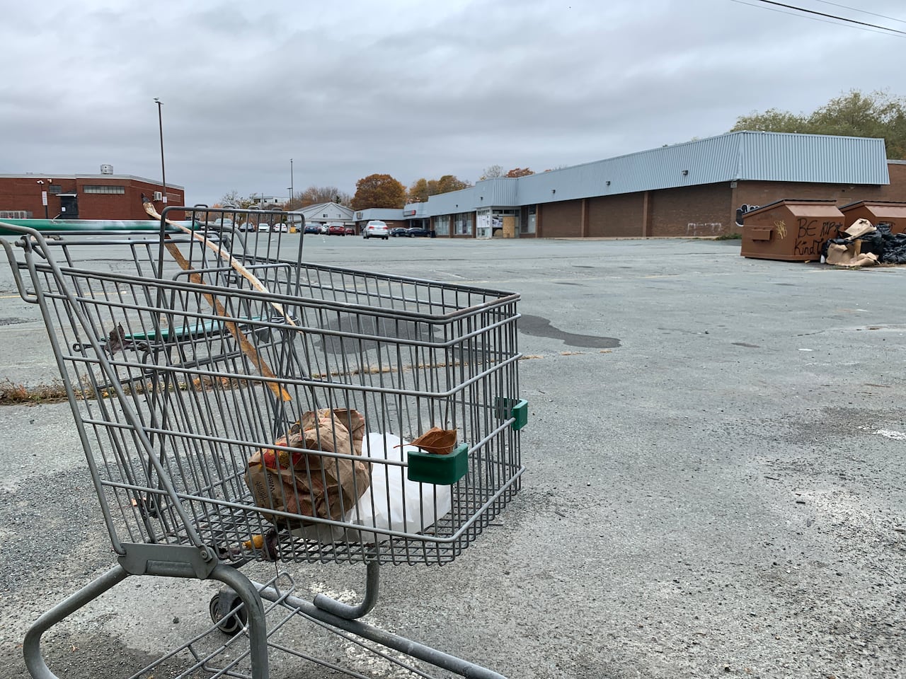 The former Sobeys location on Pleasant Street in Dartmouth is pictured in the background, beside an abandoned shopping cart.