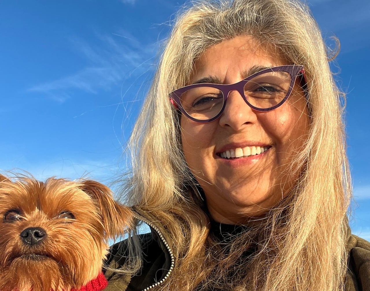 Rena Hans holding her dog. 