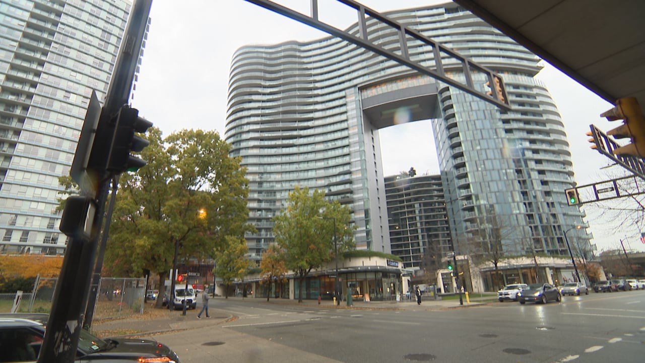A large high-rise building on a rainy day.